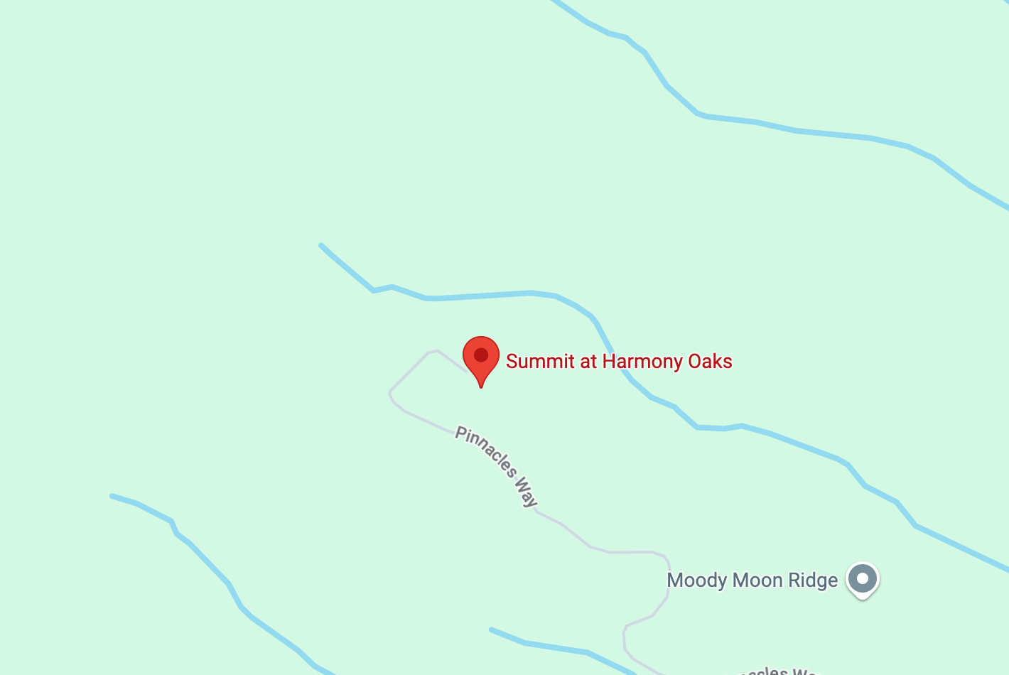 Map highlighting Summit at Harmony Oaks with a red location marker. Nearby roads include Pinnacle Way and Moody Moon Ridge. The map features a light green background representing topographic lines or landscape features.